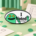 I Voted for Mr Frog enamel pin in a playful green voting scene