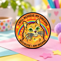 I Will Achieve My Dreams Rainbow Cat Pin on a playful pastel background