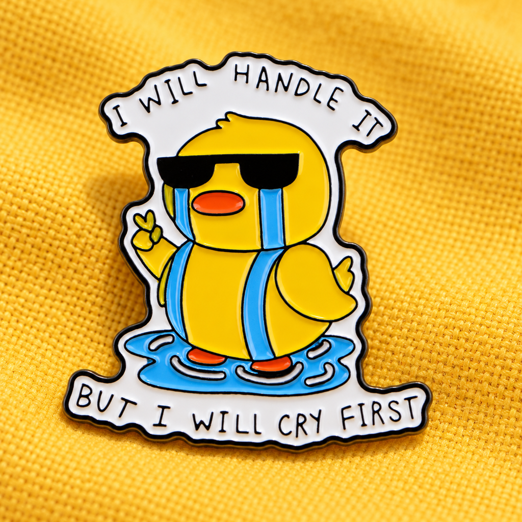 I Will Handle It But I Will Cry First duck enamel pin on yellow fabric
