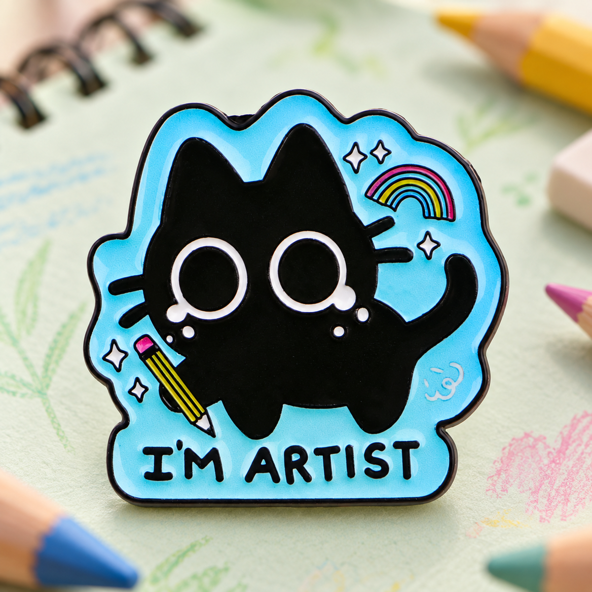 I'm Artist Black Cat enamel pin on a colorful sketchbook background