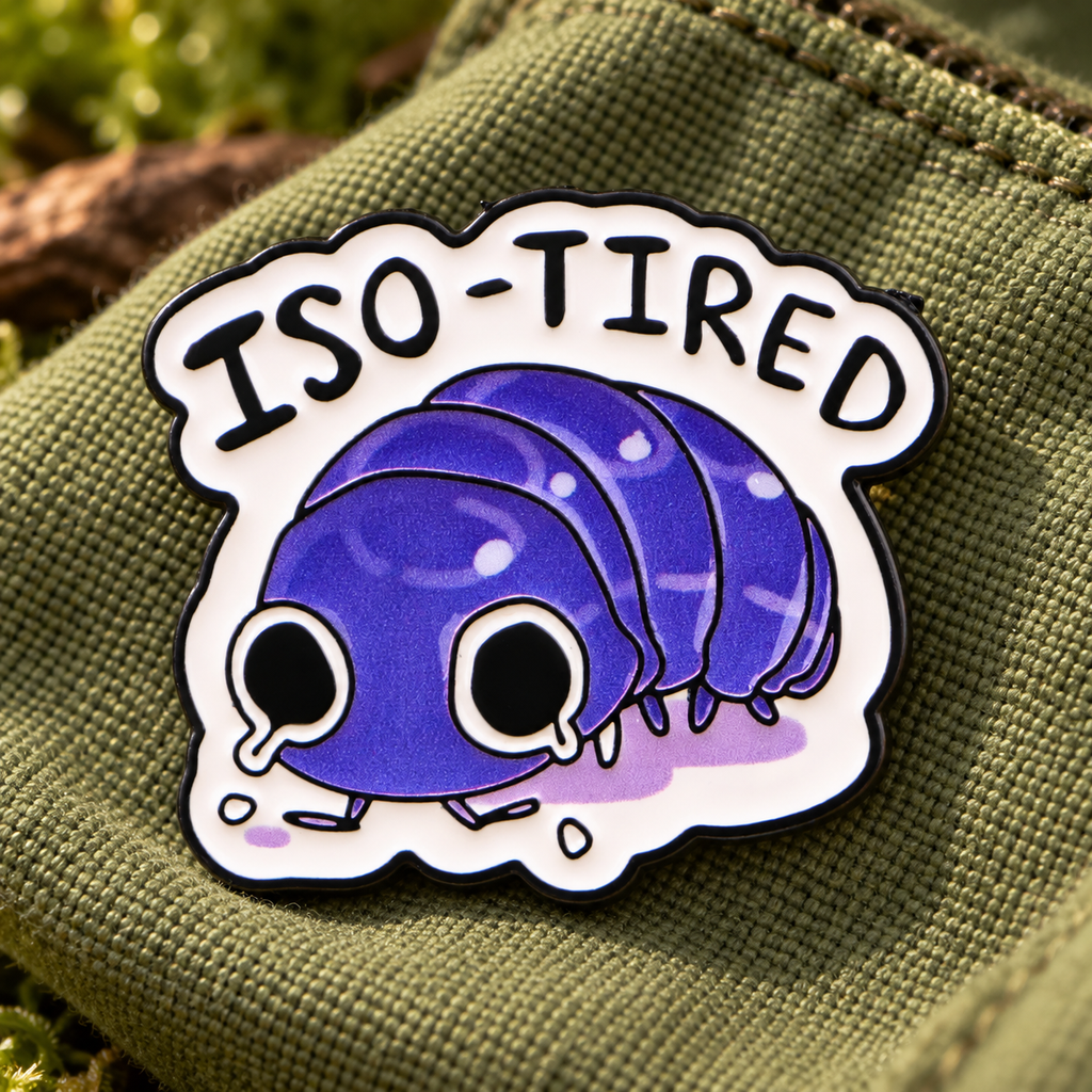 Iso-tired isopod bug enamel pin on moss green canvas