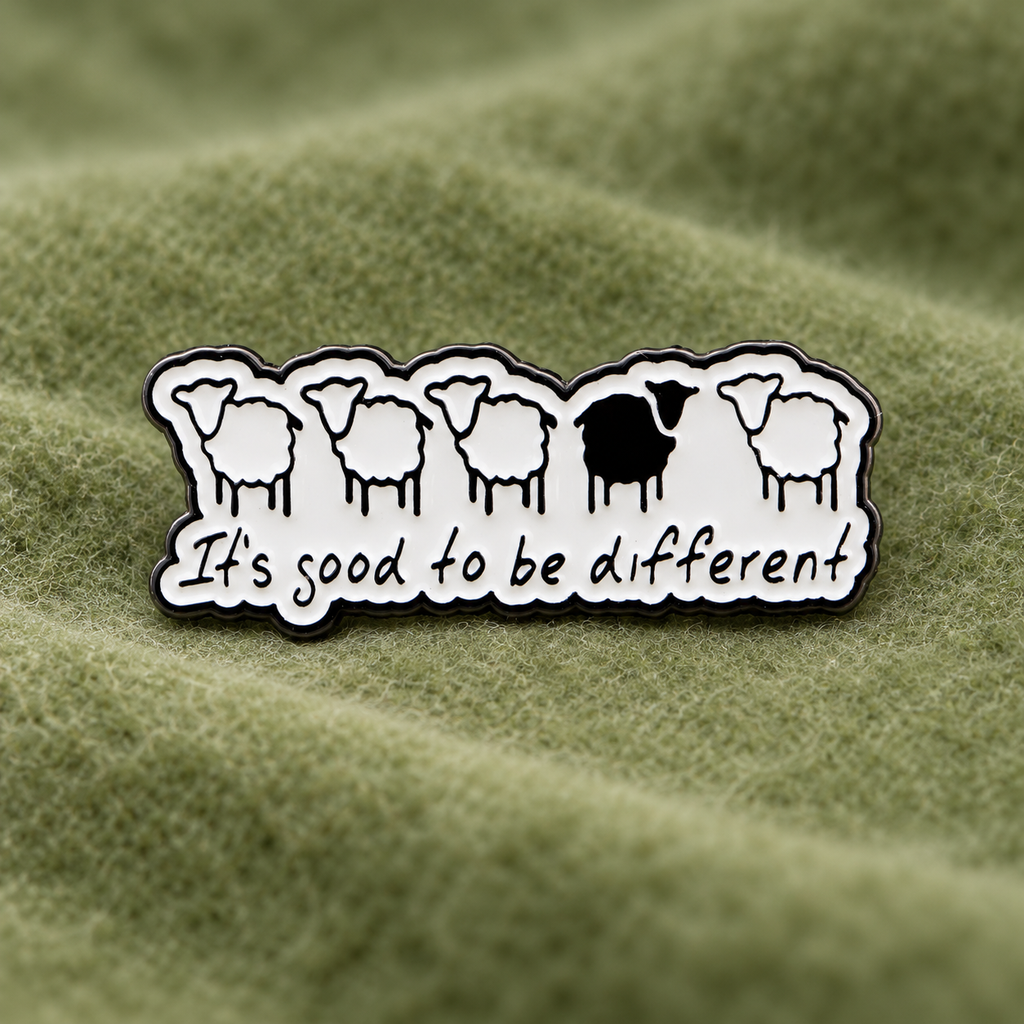 It's Good to Be Different sheep enamel pin on green felt