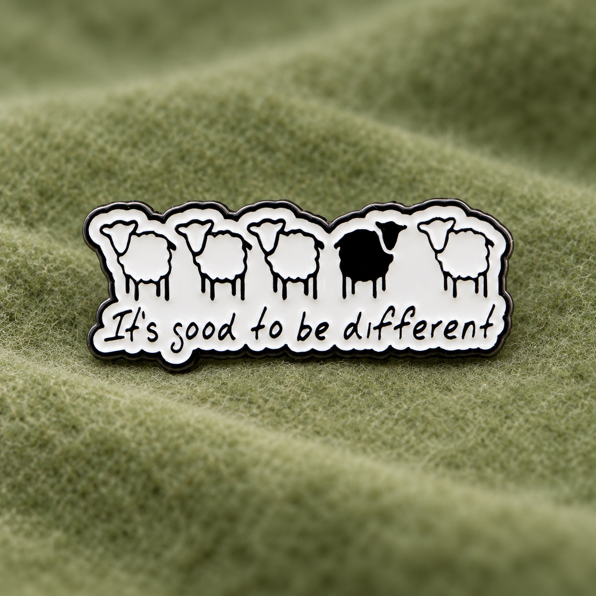 It's Good to Be Different sheep enamel pin on green felt