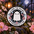 "Living The Dream" Ghost Pin enamel pin on a themed background