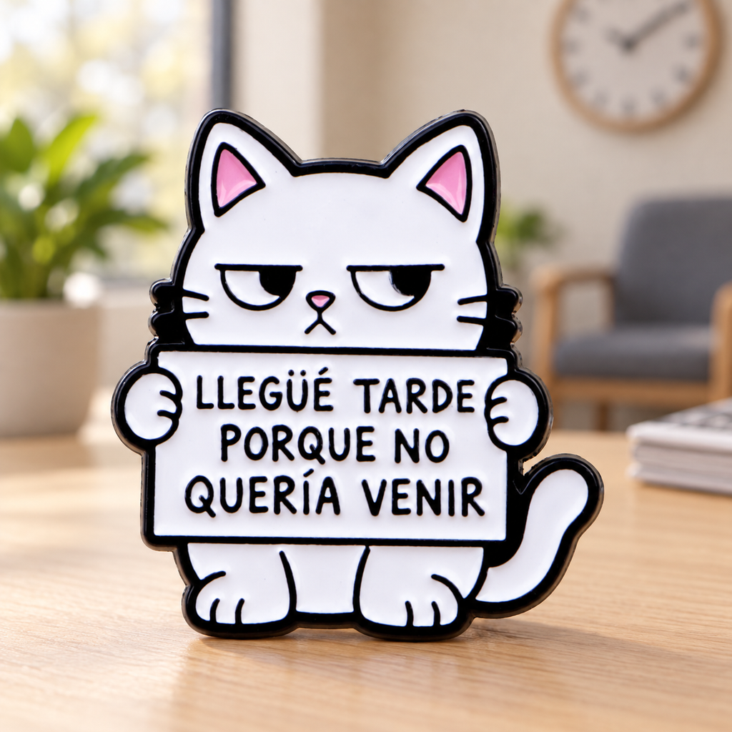 Spanish late cat enamel pin in a warm waiting-room setting