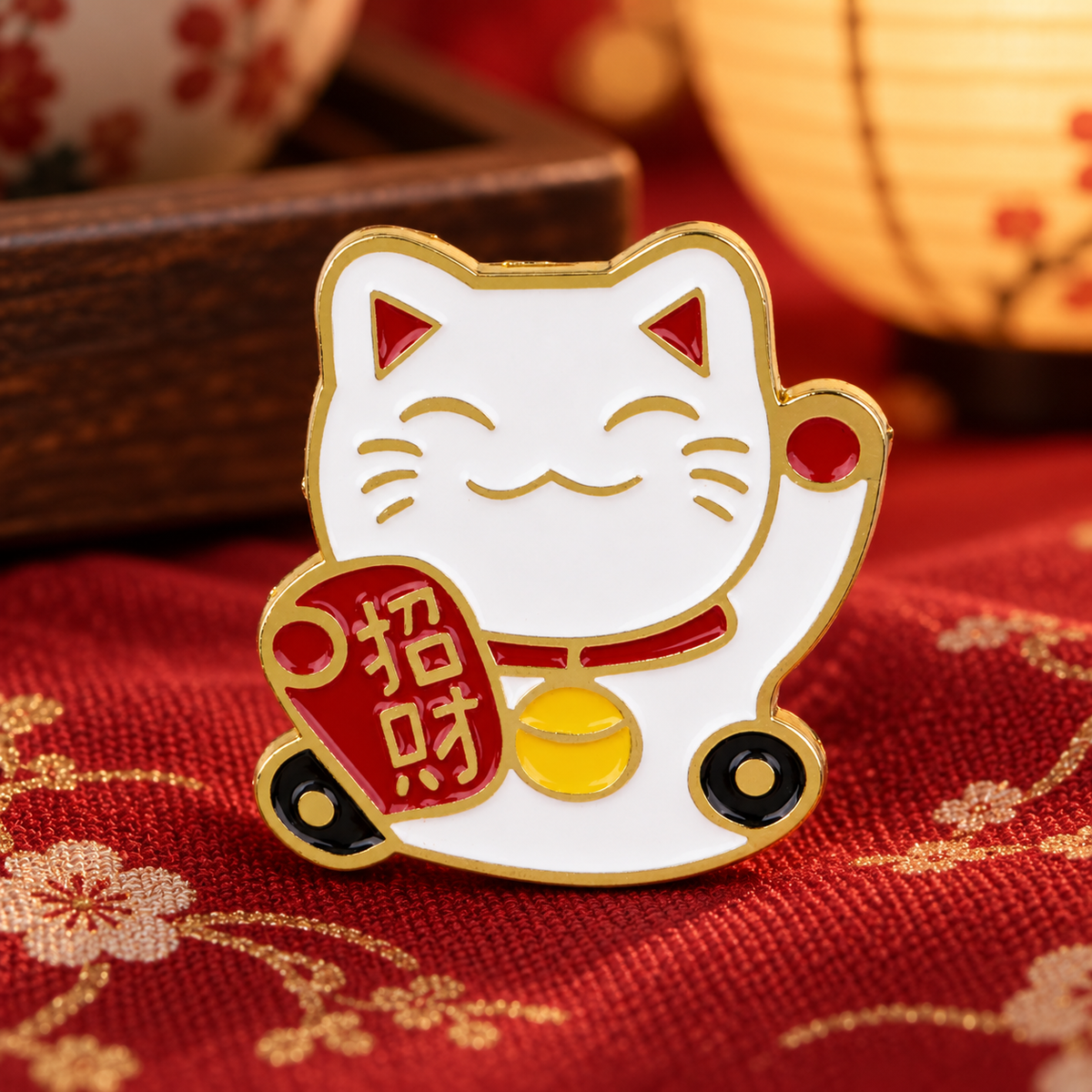 Lucky Cat Maneki Neko enamel pin on red Japanese-style fabric