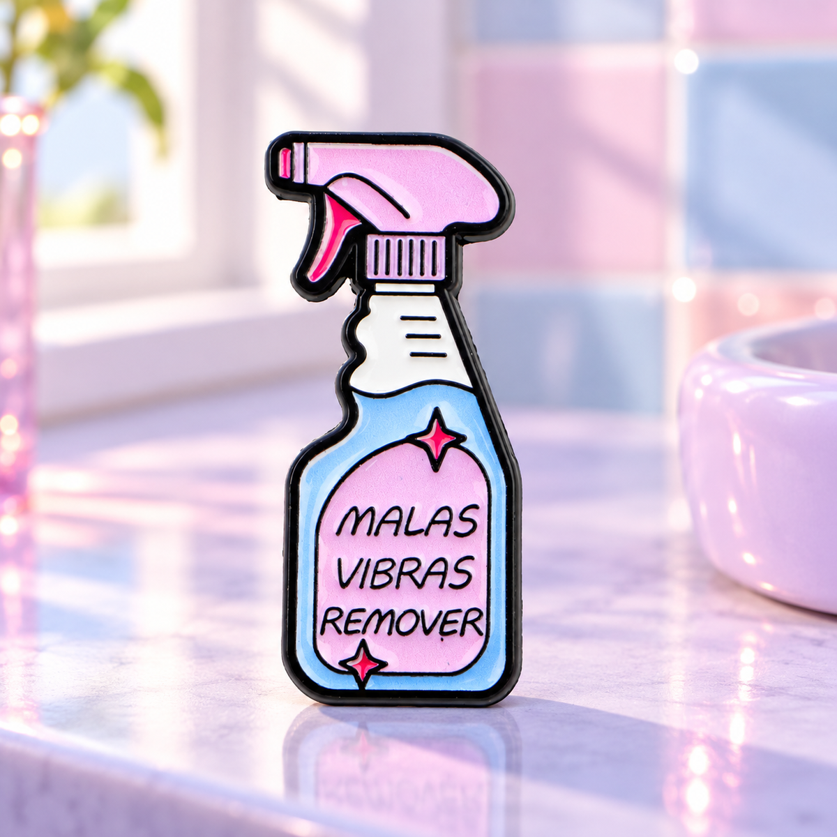 Malas Vibras Remover spray bottle pin on a pastel vanity