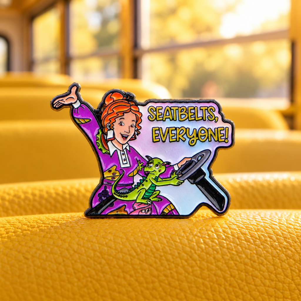 Ms Frizzle Seatbelts Everyone Pin on a school-bus seat
