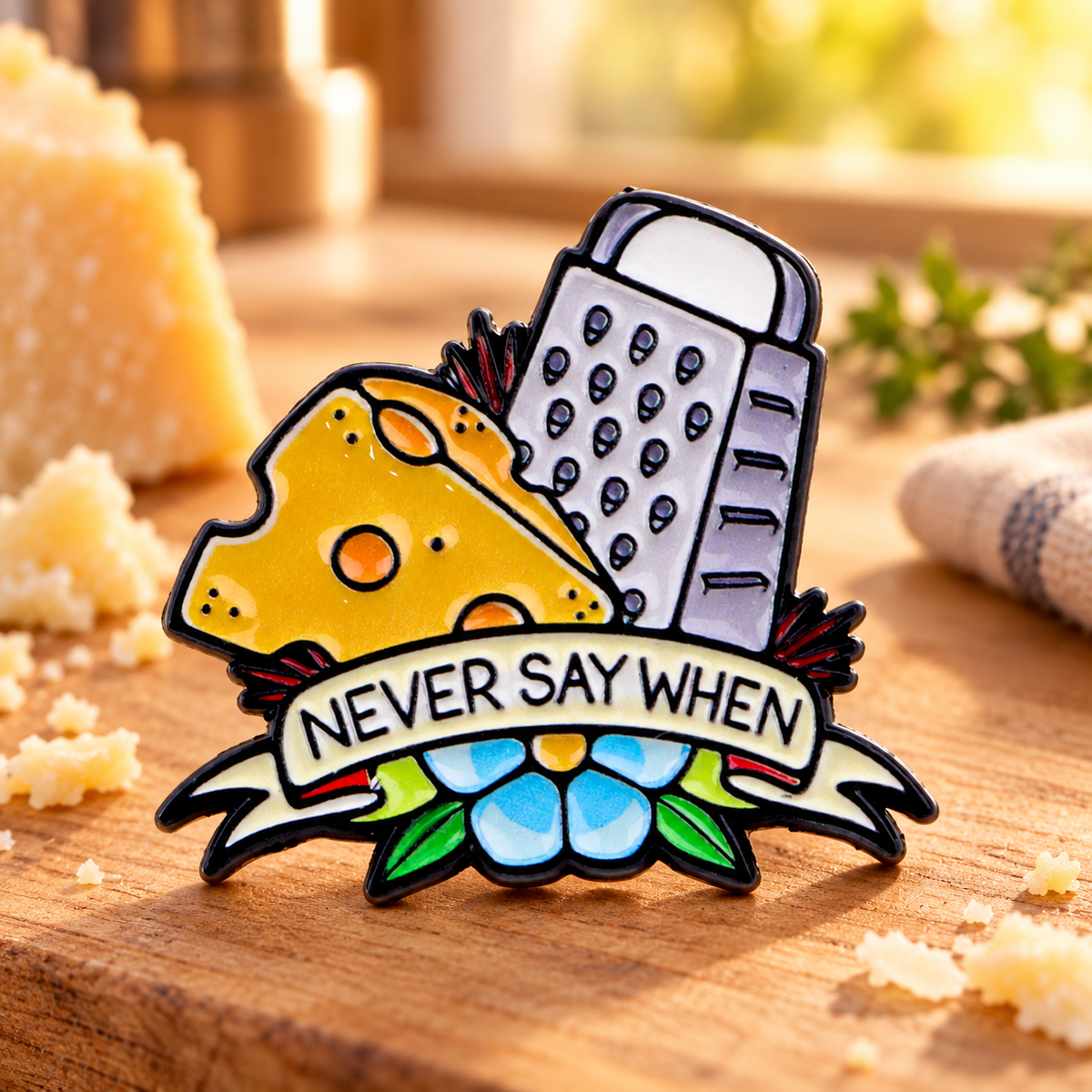 Never Say When Cheese Grater Pin on a warm cheese board