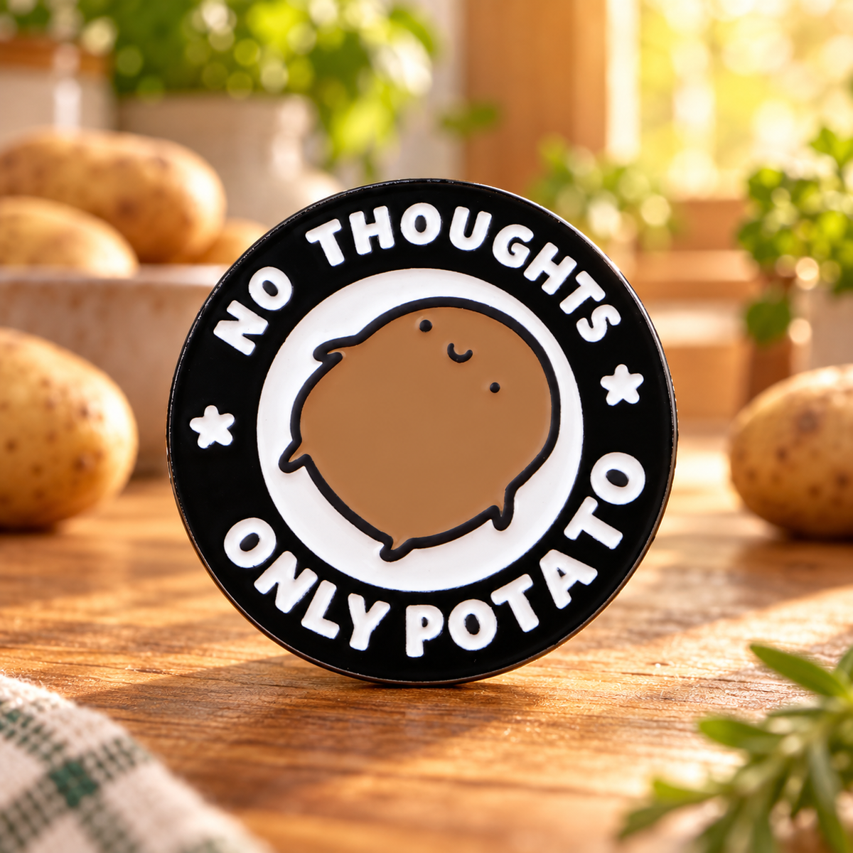 No Thoughts Only Potato enamel pin in a cozy kitchen