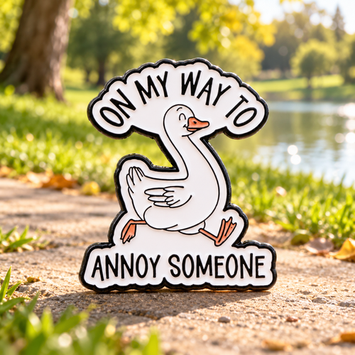 On My Way to Annoy Someone Goose Pin beside a sunny park pond