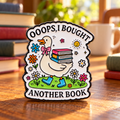 Goose enamel pin with books in a warm reading nook