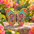 Ornate Floral Butterfly Pin in a blooming garden