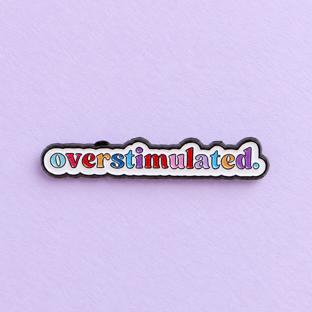 Overstimulated Colourful Lettering Pin on lavender paper