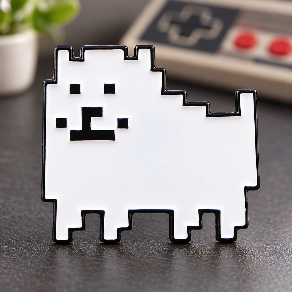 Pixel Dog Pin enamel pin on a retro gaming desk