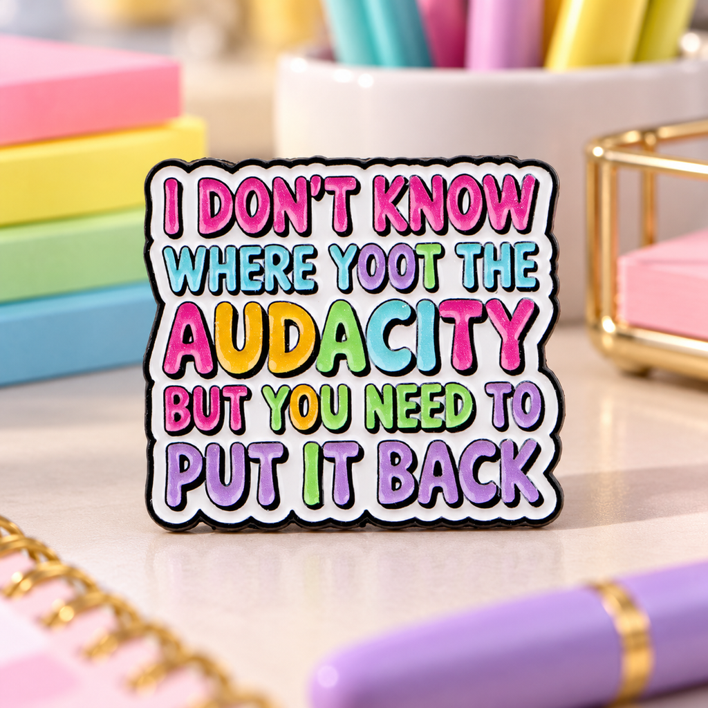 Put the Audacity Back Pin on a colorful office stationery background