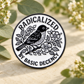 Radicalized by Basic Decency bird enamel pin in a sage botanical scene