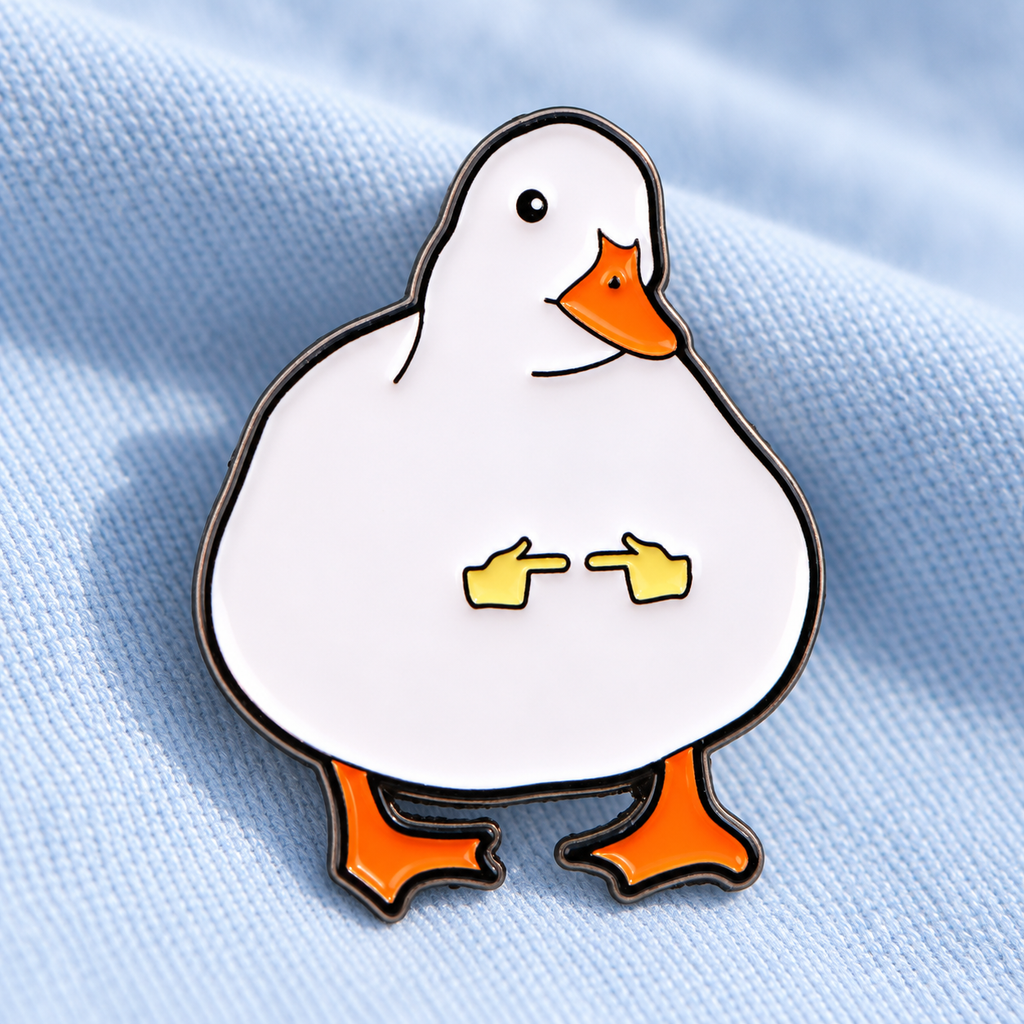 Shy Duck enamel pin on pale blue cotton fabric