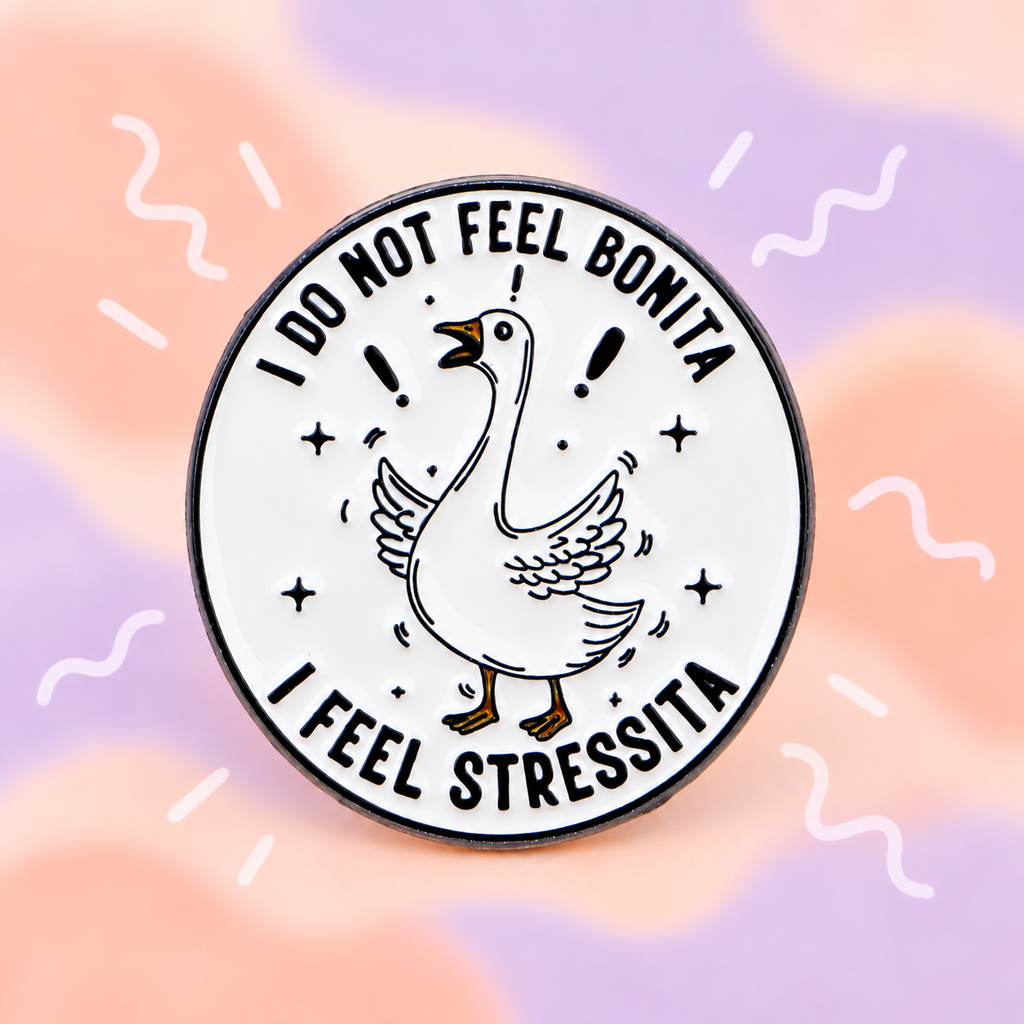 I Do Not Feel Bonita Stressed Goose enamel pin on a peach and lilac background