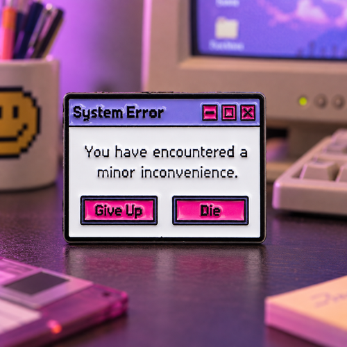 System Error Minor Inconvenience enamel pin on a retro computer desk