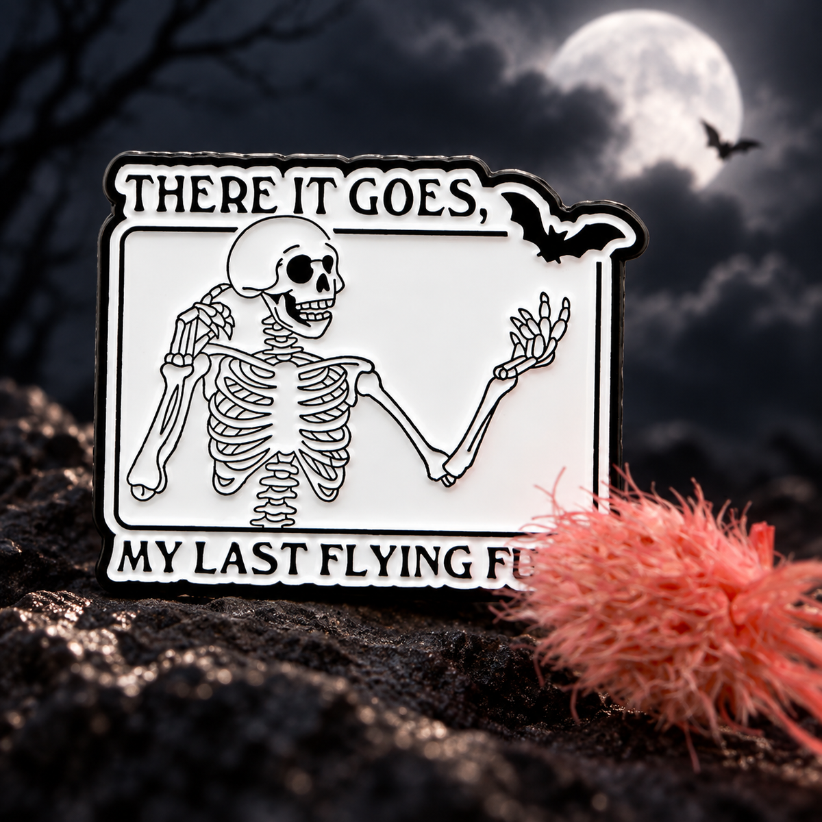 There It Goes, My Last Flying F*ck Skeleton Pin enamel pin on a themed background