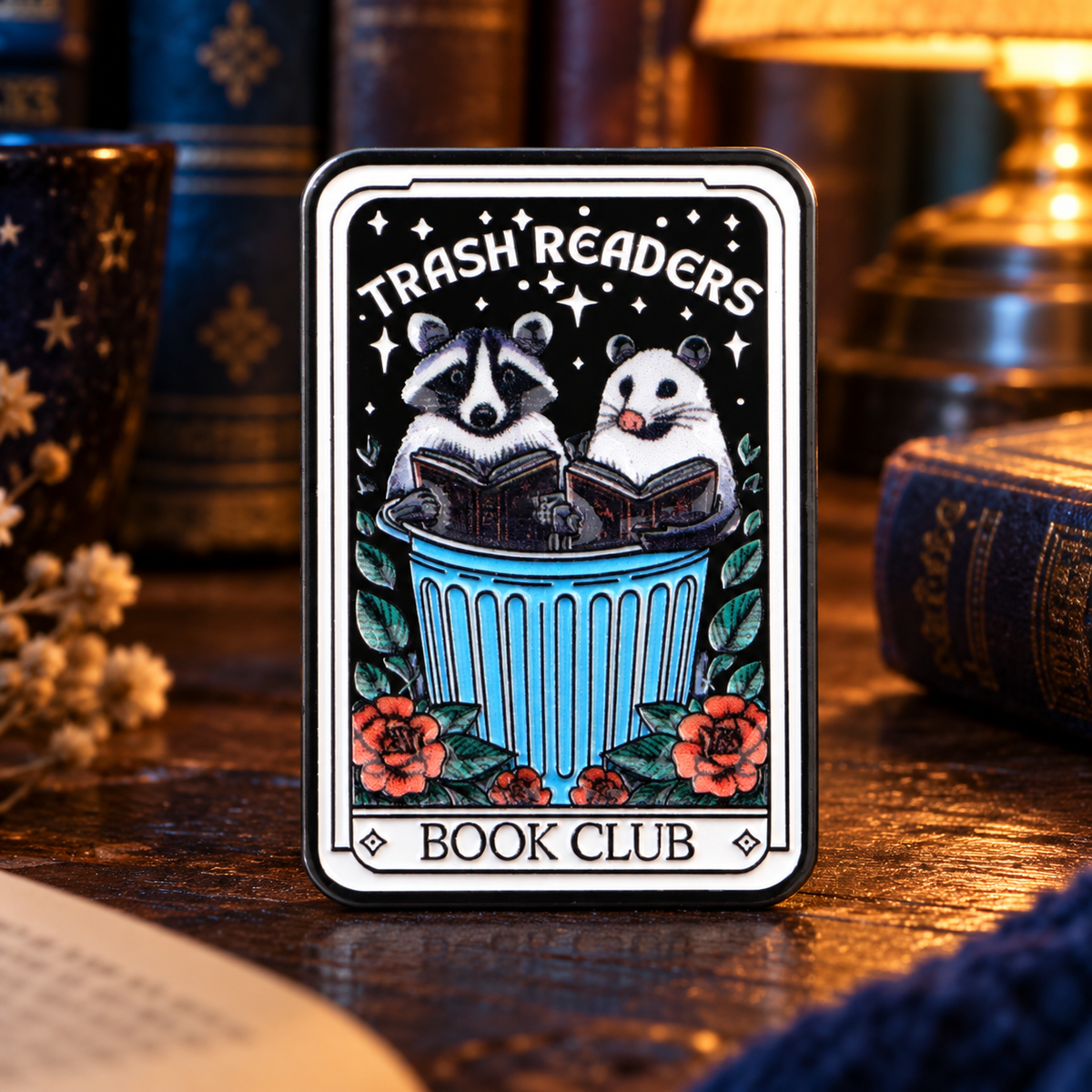 Trash Reader Book Club Pin in a moody reading room