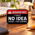 Warning I Have No Idea What I Am Doing enamel pin on a creative desk