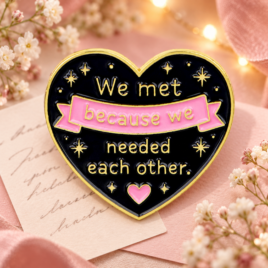 We Met Because We Needed Each Other Heart Pin on a warm pink floral background