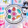 What Doesn't Kill You Mutates and Tries Again pin against a colorful microbiology lab backdrop