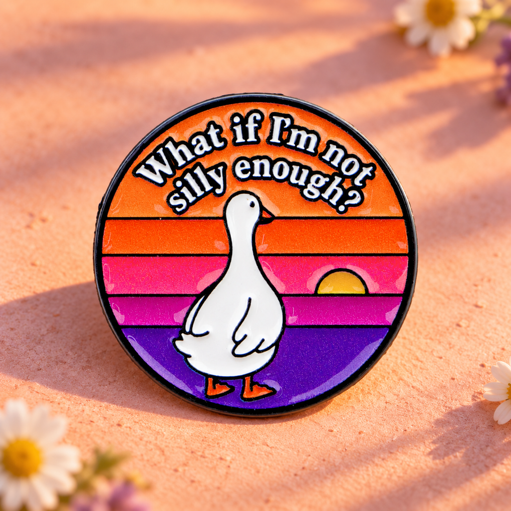 What If I'm Not Silly Enough Goose pin on a peach tabletop