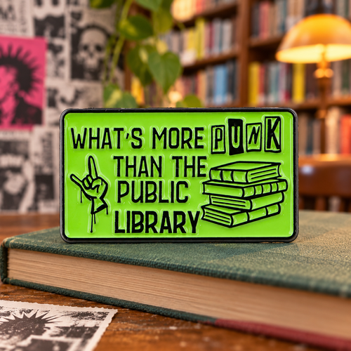 What's More Punk Than the Public Library enamel pin against a cozy public-library backdrop