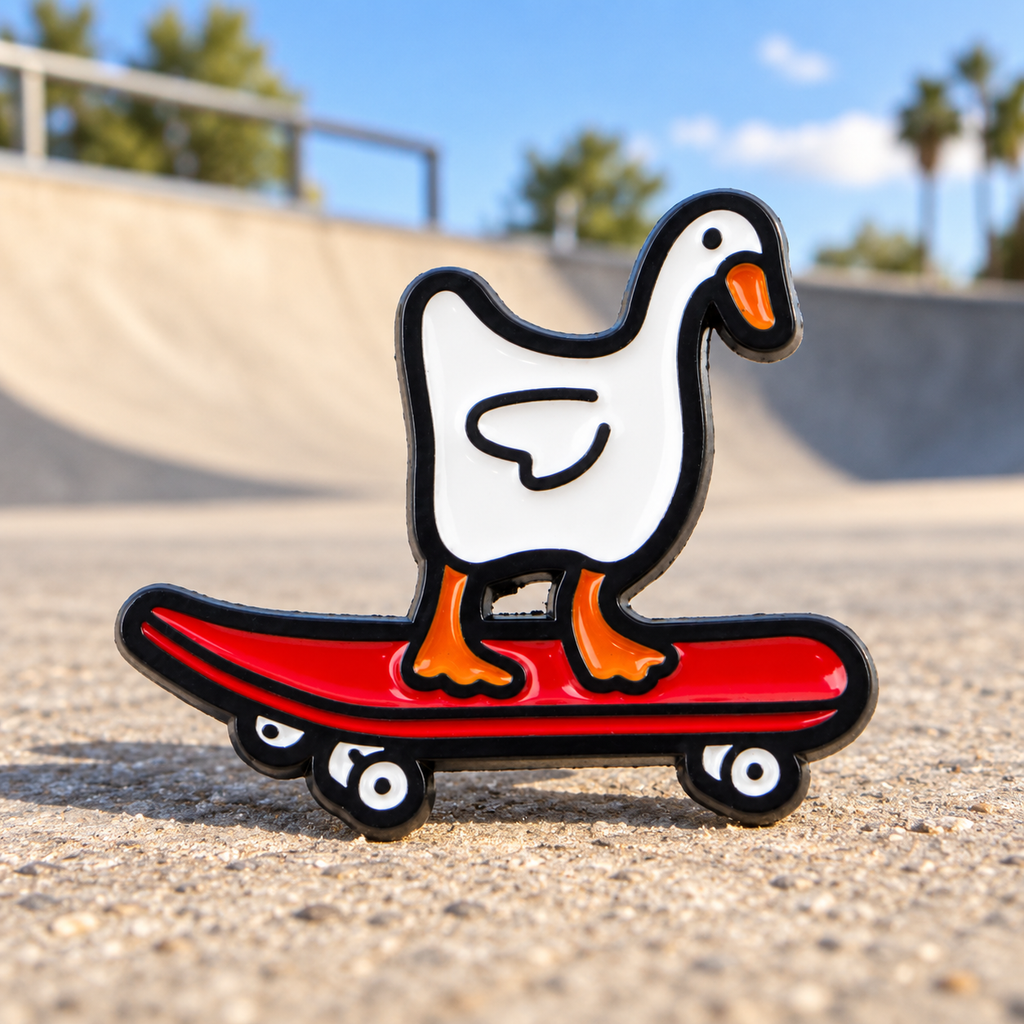 White Goose on a Skateboard enamel pin at a sunny skatepark
