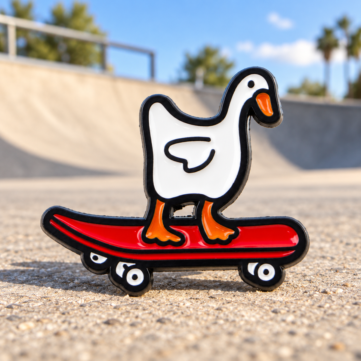 White Goose on a Skateboard enamel pin at a sunny skatepark