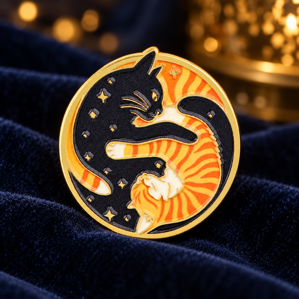 Black and Orange Yin Yang Cats enamel pin on midnight-blue velvet