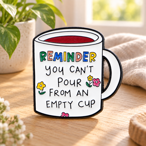 You Can't Pour from an Empty Cup enamel pin in a serene morning setting